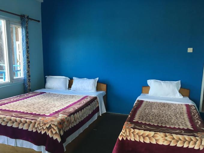 Read more about the article Double Bed with Private Bathroom